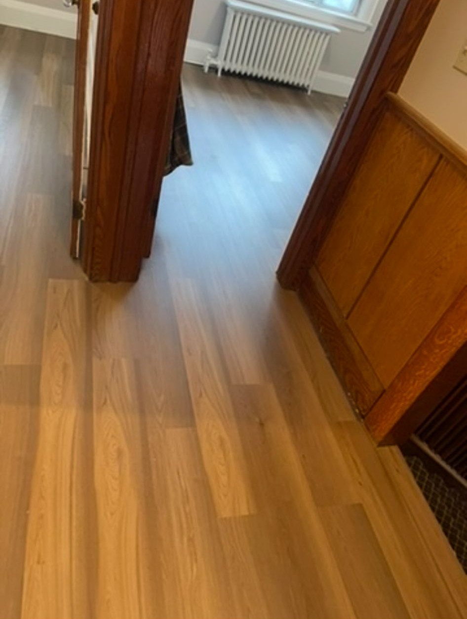 Beautiful engineered hardwood flooring installed in Toronto bedroom with rich wood grain detail