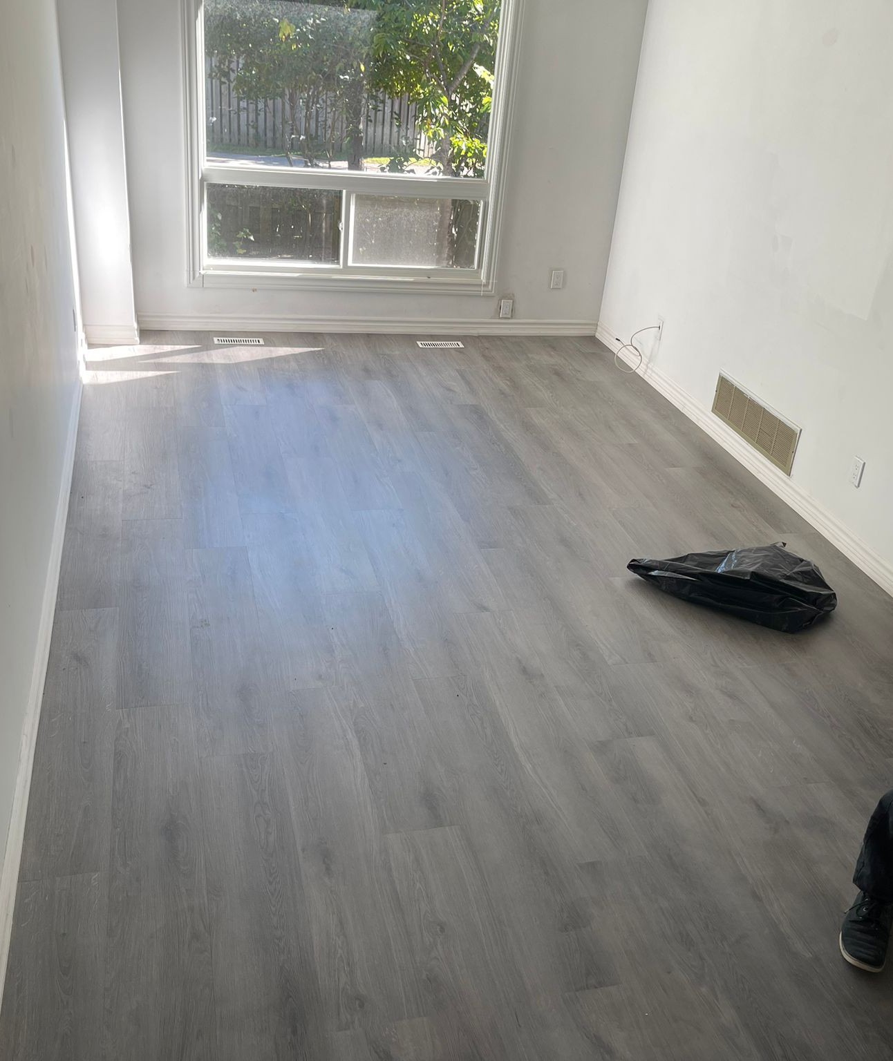 Modern waterproof vinyl plank flooring installed in Toronto residential living room